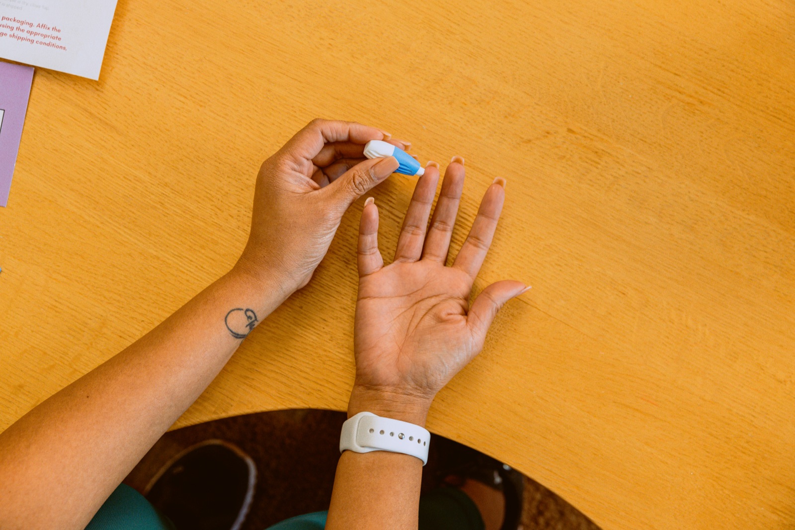 Patient collecting an at-home lab sample with a Nimbus test kit